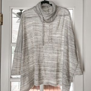Cozy gray and white poncho like sweater with sleeves. Barely worn, like new.